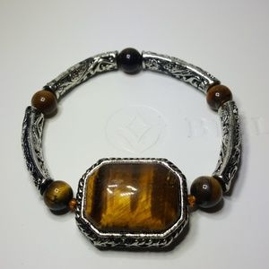 Brown and carved silver stretch bracelet.